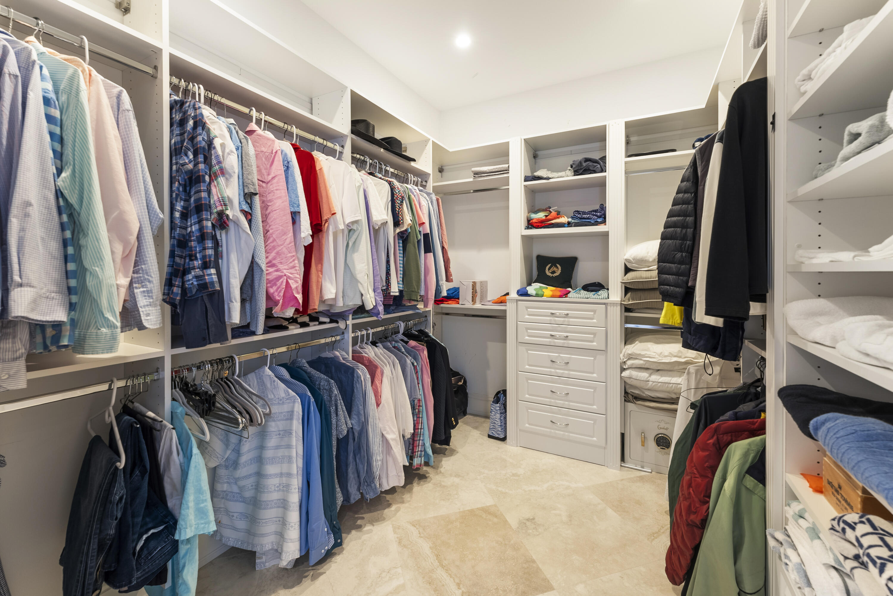 975 Banyan Drive Delray Beach, FL 33483 - Photo 25 of 66 a view of walk in closet with clothes and shoes