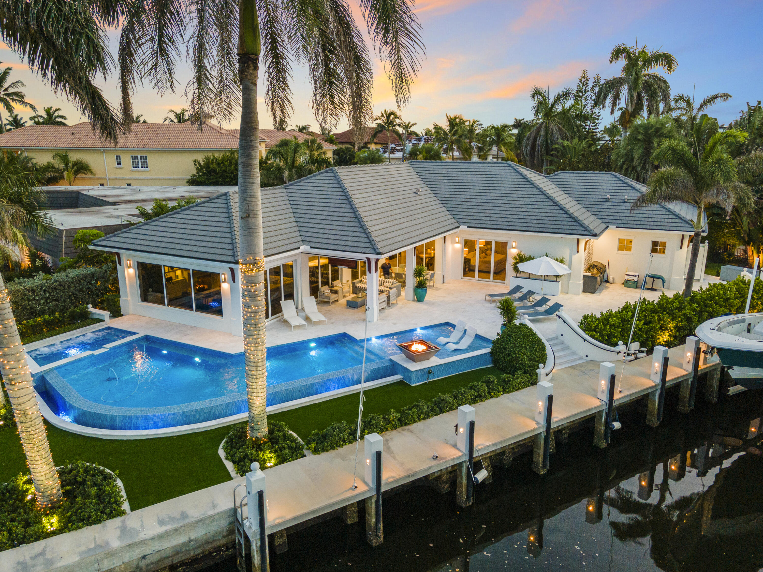 975 Banyan Drive Delray Beach, FL 33483 - Photo 3 of 66 a view of house with swimming pool outdoor seating