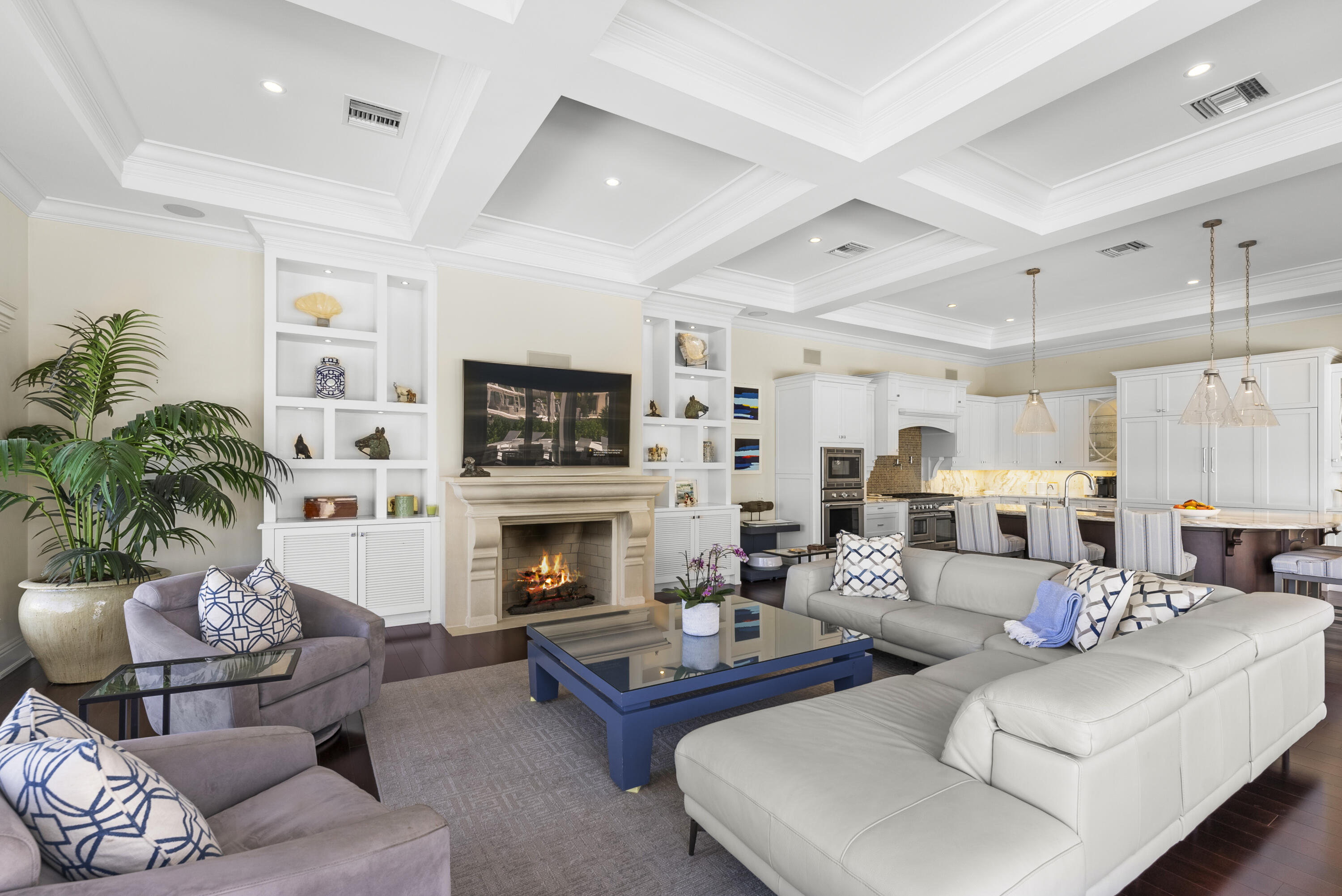 975 Banyan Drive Delray Beach, FL 33483 - Photo 50 of 66 a living room with furniture flat screen tv and a fireplace