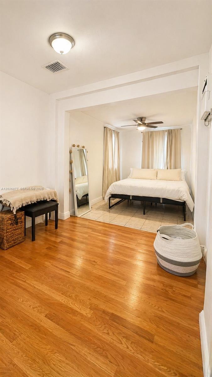 2727 Southwest 24th Street Miami, FL 33145 - Photo 14 of 18 a living room with dining room and wooden floor
