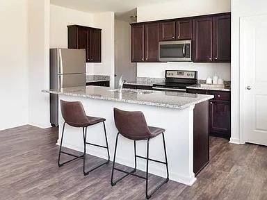 166 Verona Drive Northwest Cartersville, GA 30120 - Photo 5 of 13 a kitchen with stainless steel appliances a stove refrigerator and microwave