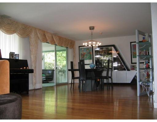 200 Crafts Road Brookline, MA 02467 - Photo 1 of 6 a kitchen with dining room and wooden floor