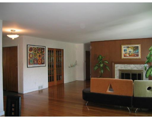 200 Crafts Road Brookline, MA 02467 - Photo 2 of 6 a living room with furniture and a fireplace