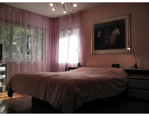 200 Crafts Road Brookline, MA 02467 - Photo 4 of 6 a bedroom with a bed and a painting on the wall