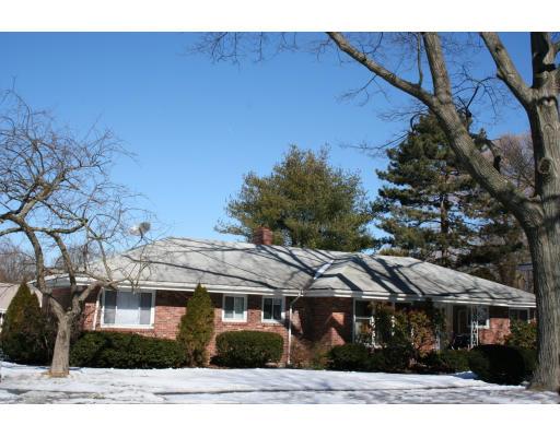 200 Crafts Road Brookline, MA 02467 - Photo 6 of 6 a front view of a house with a garden