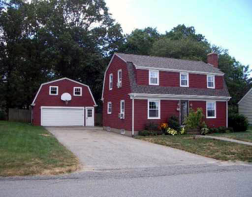 a view of a brick house with a yard