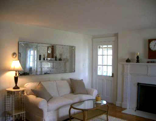 25 Hambly Road Tiverton, RI 02878 - Photo 3 of 8 a living room with furniture and a fireplace