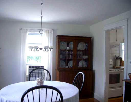 25 Hambly Road Tiverton, RI 02878 - Photo 4 of 8 a view of a dining room with furniture window and wooden floor