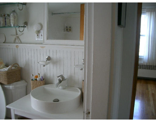 25 Hambly Road Tiverton, RI 02878 - Photo 8 of 8 a bathroom with a sink and a mirror