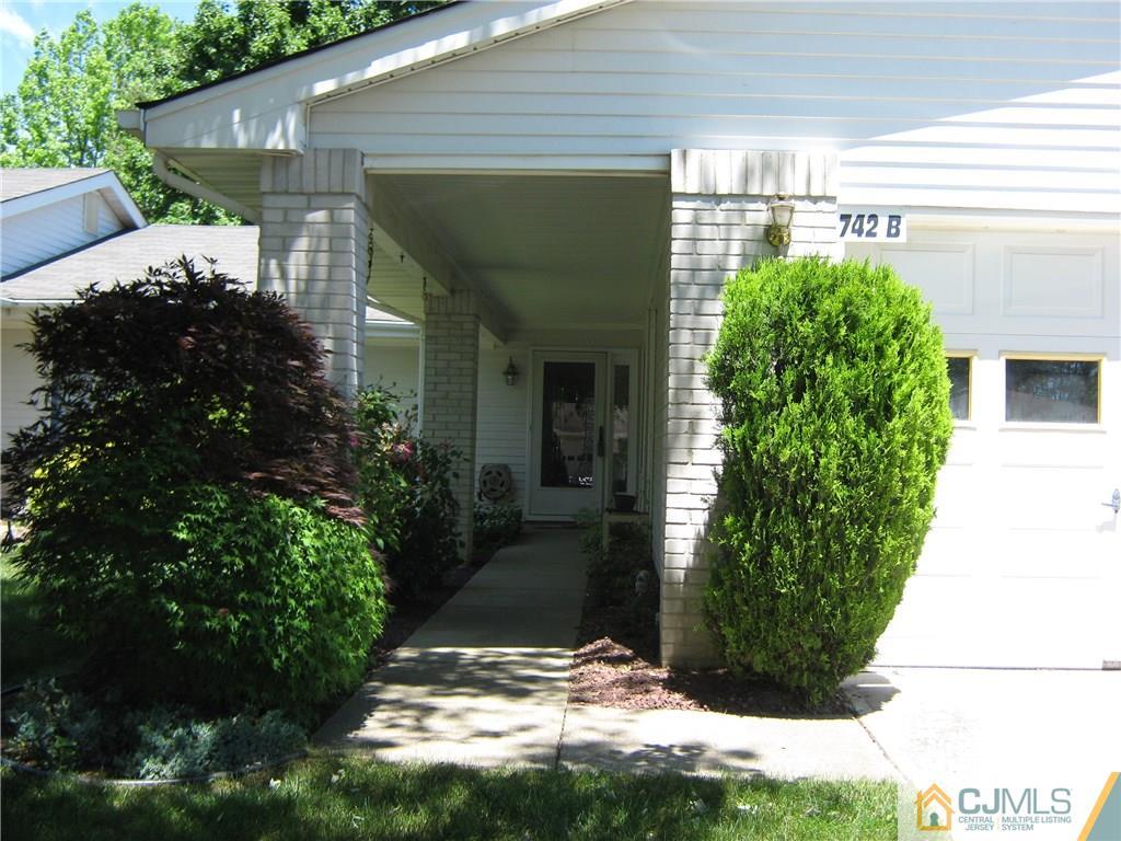 742 B Pompton Road Monroe Township, NJ 08831 - Photo 2 of 11 a front view of a house with garden