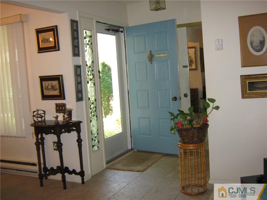 742 B Pompton Road Monroe Township, NJ 08831 - Photo 4 of 11 a view of a entryway with flower pots