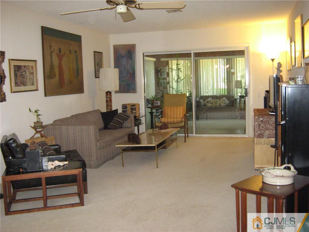 742 B Pompton Road Monroe Township, NJ 08831 - Photo 5 of 11 a living room with furniture and a floor to ceiling window