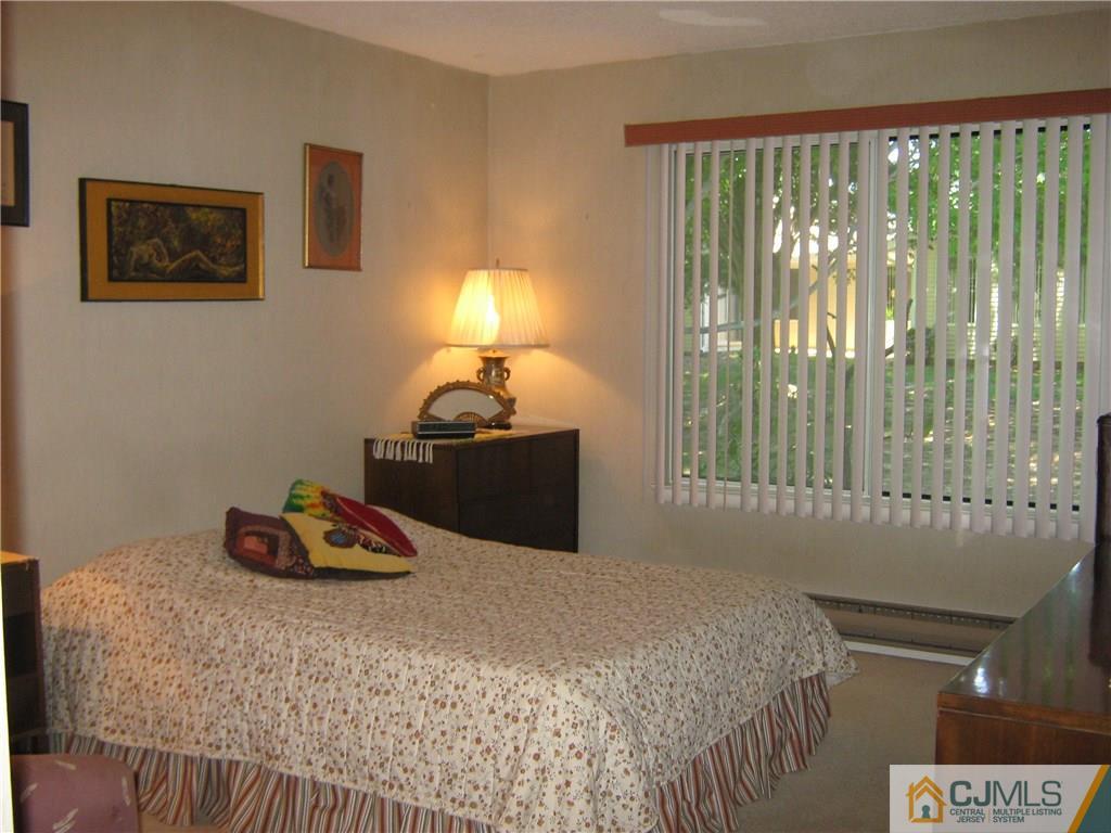742 B Pompton Road Monroe Township, NJ 08831 - Photo 8 of 11 a bedroom with a bed and a window