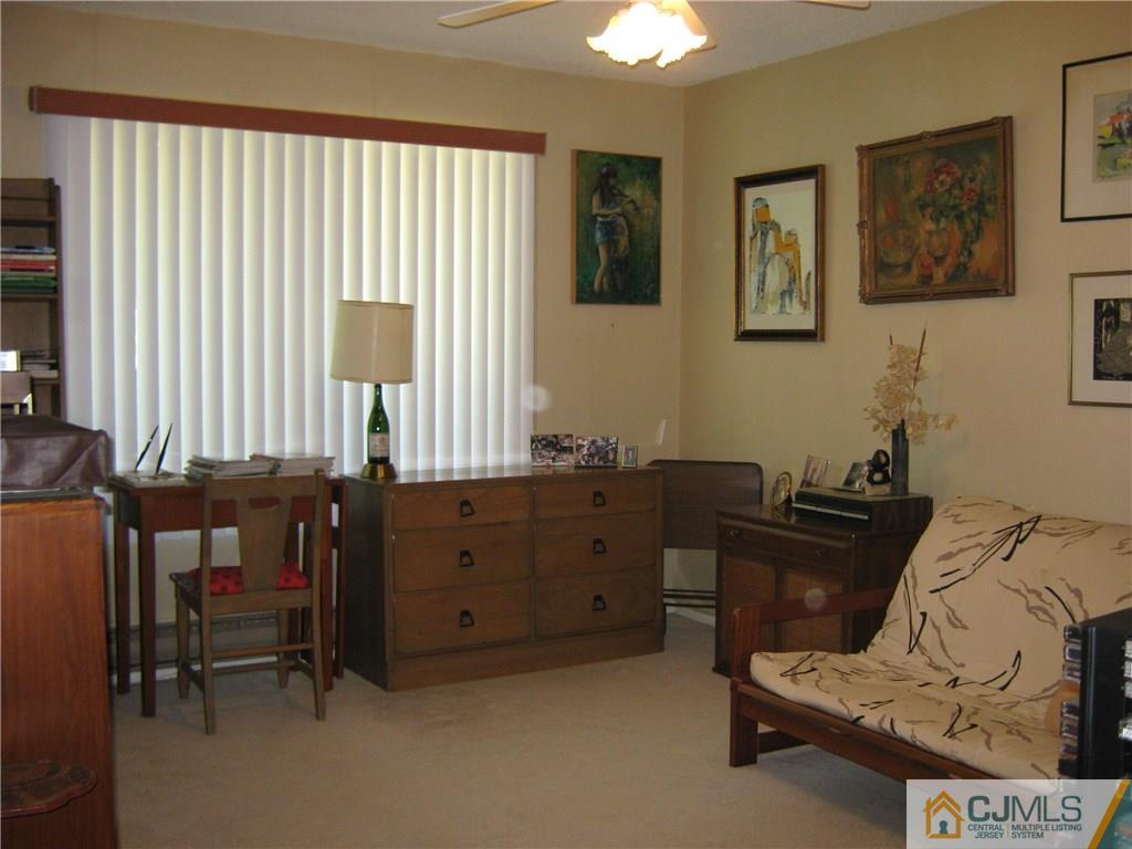 742 B Pompton Road Monroe Township, NJ 08831 - Photo 9 of 11 a bedroom with a bed and a window