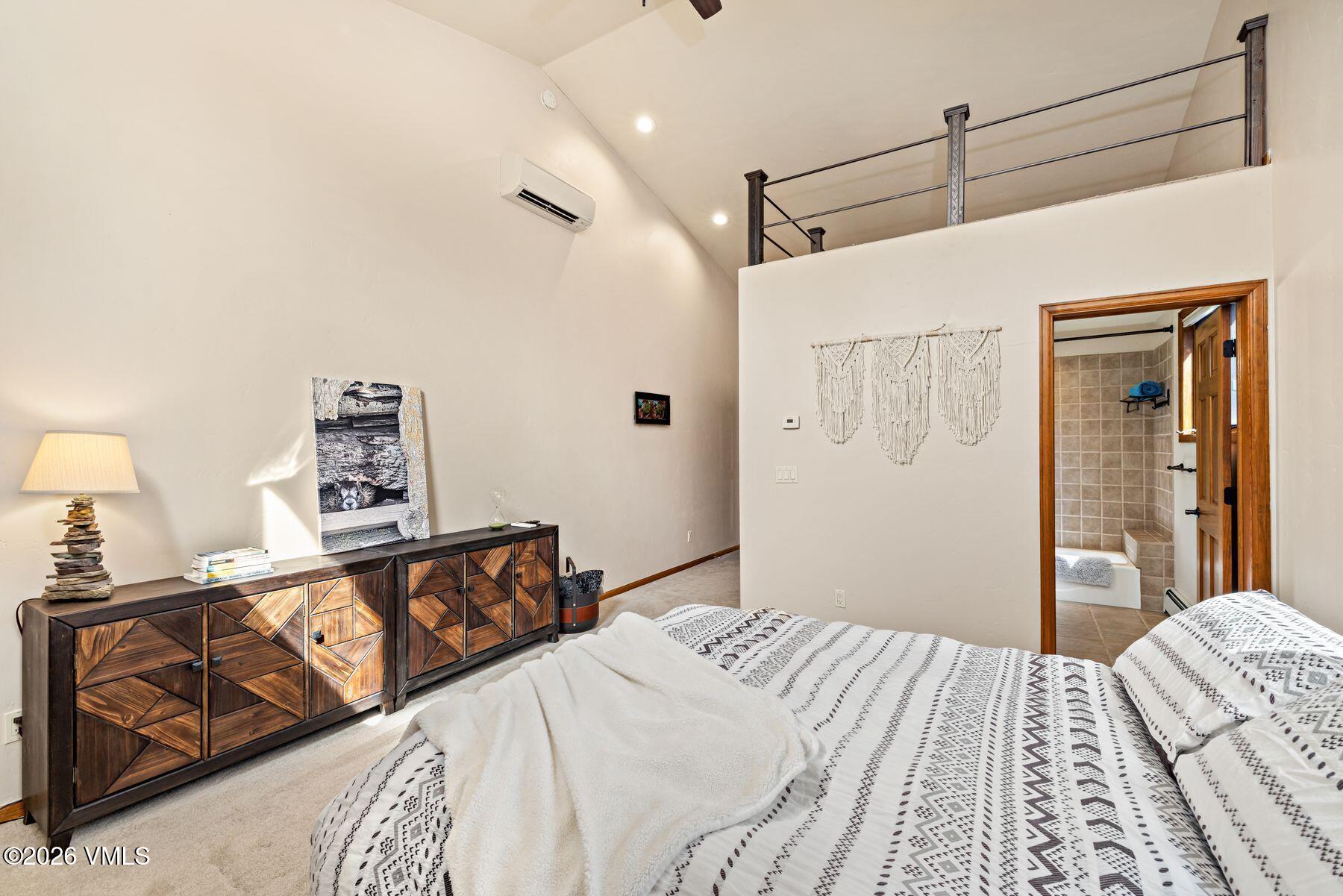 91 Creamery Trail Edwards, CO 81632 - Photo 7 of 44 a bedroom with a bed and wooden floor
