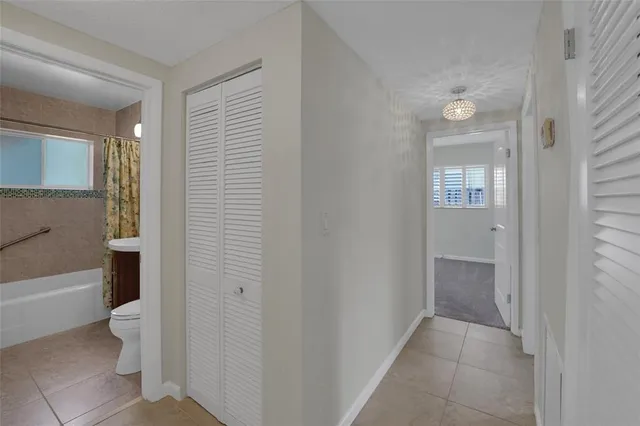 a bathroom with a sink a toilet and bathtub