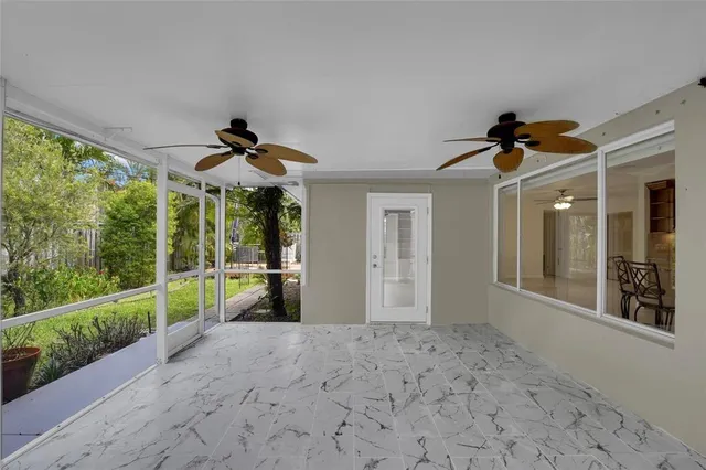 a view of a backyard with sitting area and garden