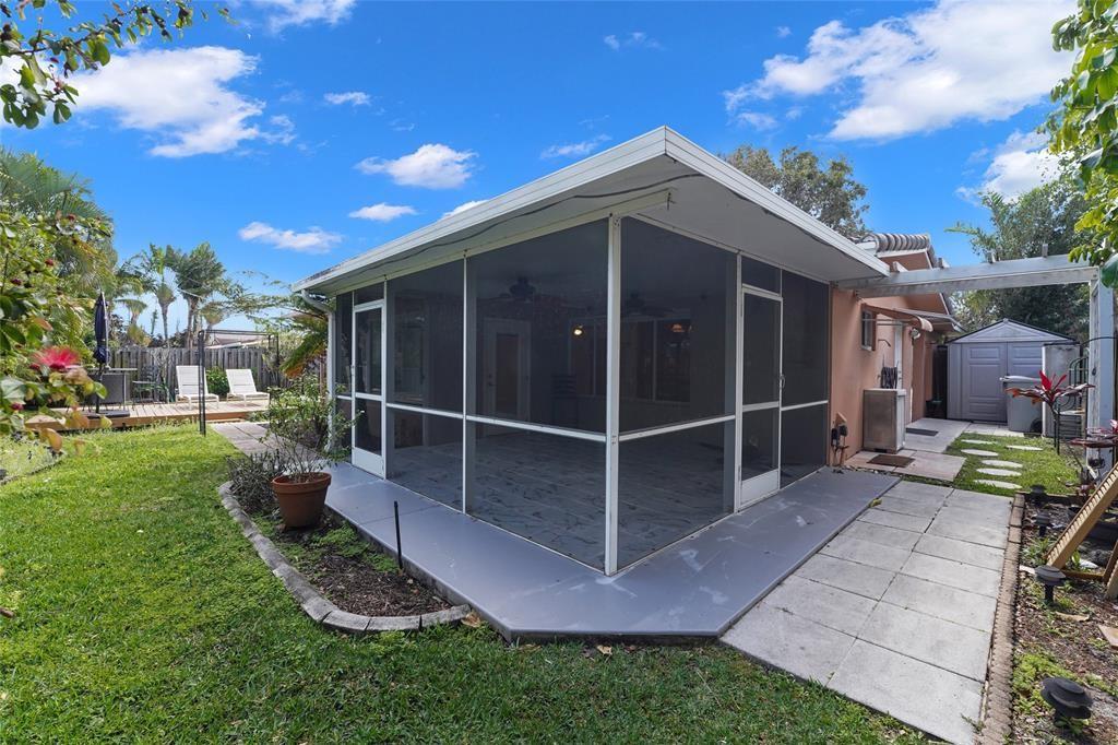 2725 Southeast 5th Court Pompano Beach, FL 33062 - Photo 31 of 37 a view of a backyard with sitting area and garden