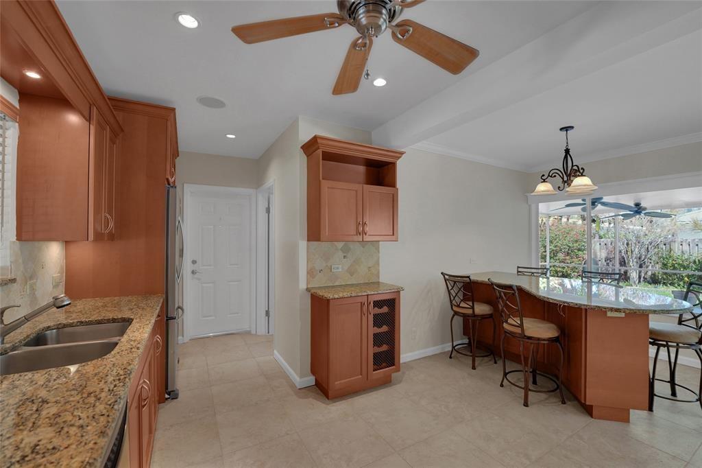 2725 Southeast 5th Court Pompano Beach, FL 33062 - Photo 10 of 37 a room with furniture and a chandelier