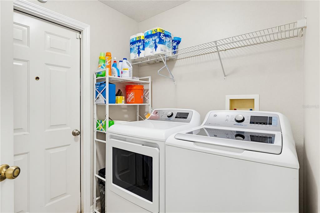 3497 Chadwick Avenue Spring Hill, FL 34609 - Photo 12 of 47 a utility room with dryer and washer