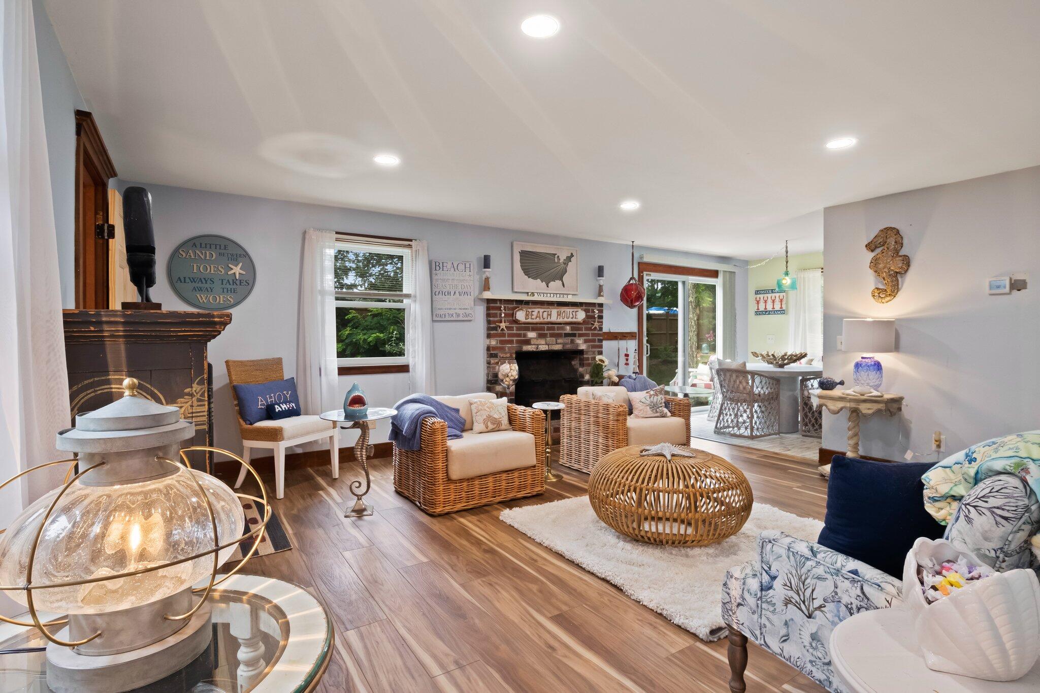 45 Designers Road Wellfleet, MA 02667 - Photo 13 of 84 a living room with furniture fireplace and a large window