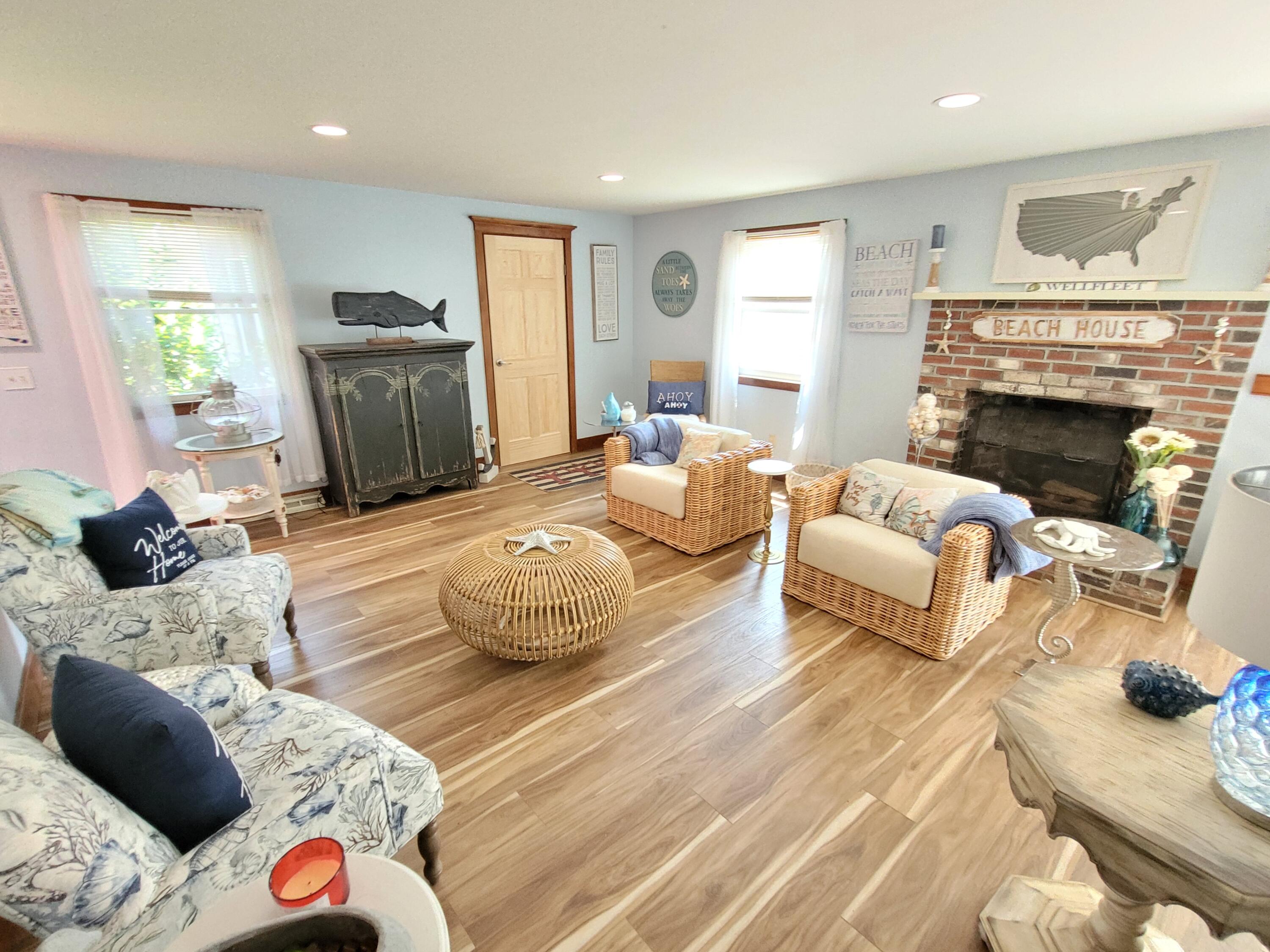 45 Designers Road Wellfleet, MA 02667 - Photo 14 of 84 a living room with furniture and a fireplace