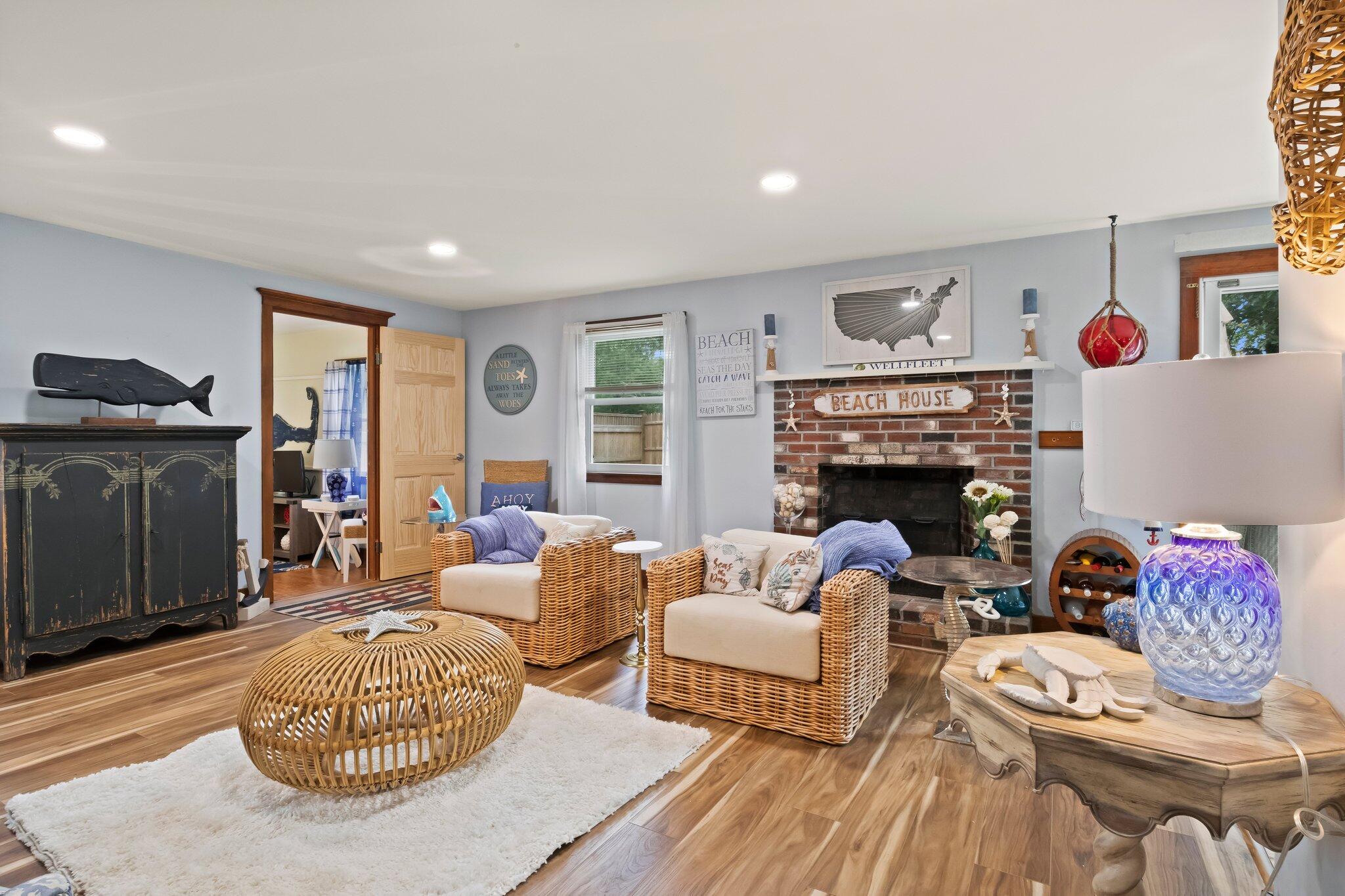 45 Designers Road Wellfleet, MA 02667 - Photo 15 of 84 a living room with furniture a rug and a fireplace