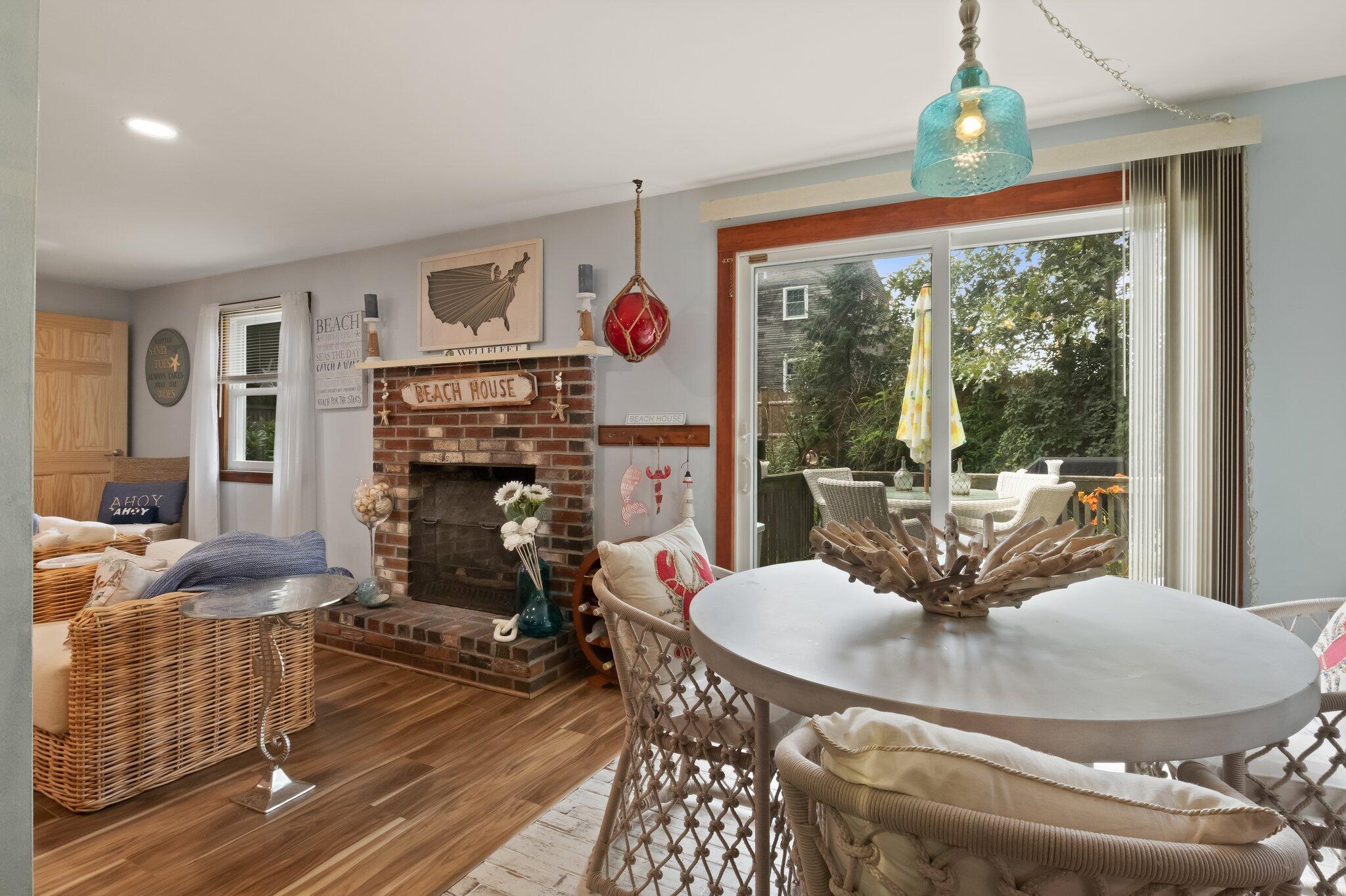 45 Designers Road Wellfleet, MA 02667 - Photo 28 of 84 a living room with fireplace furniture and a large window