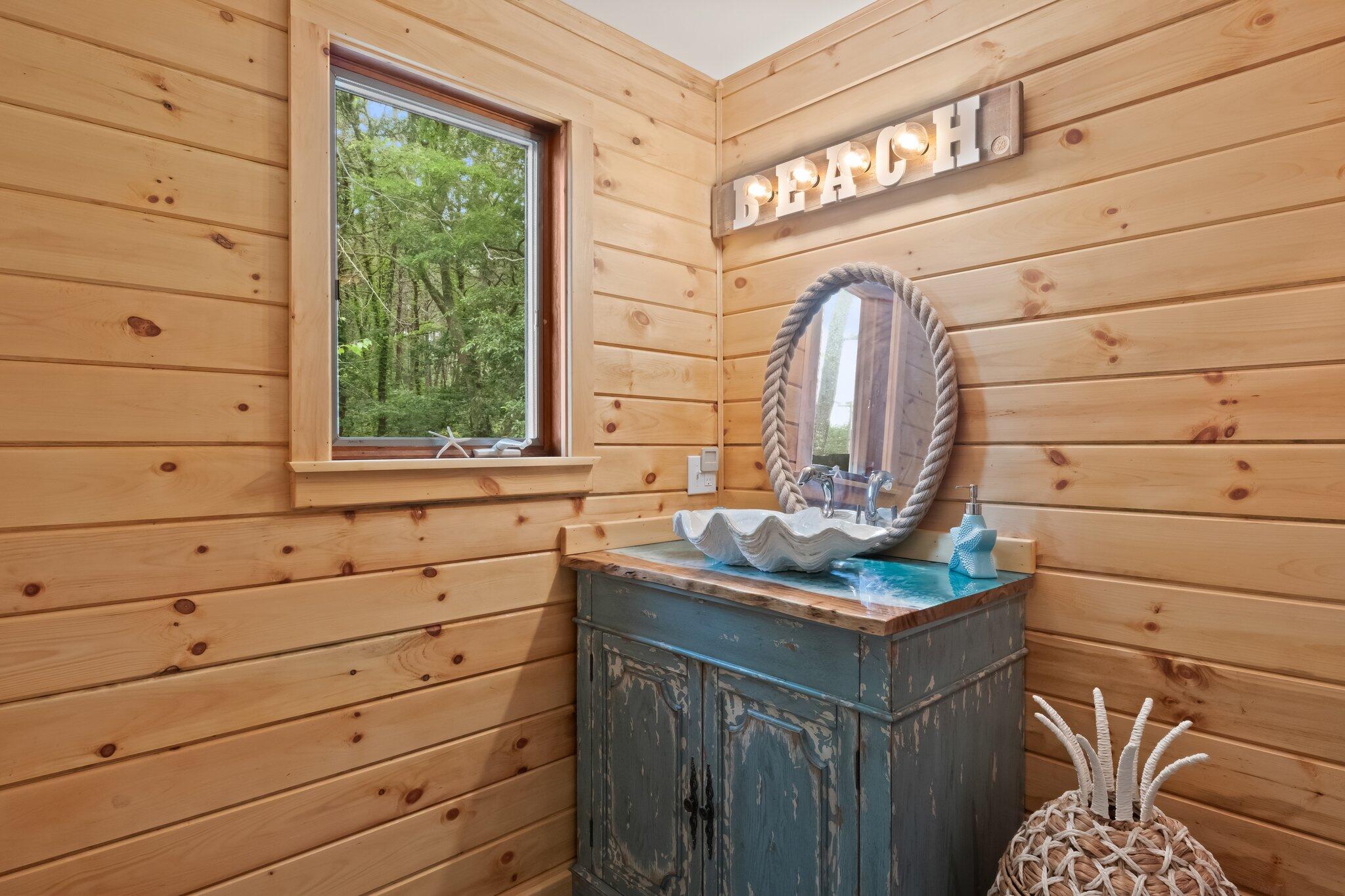 45 Designers Road Wellfleet, MA 02667 - Photo 34 of 84 a bathroom with a sink and a mirror
