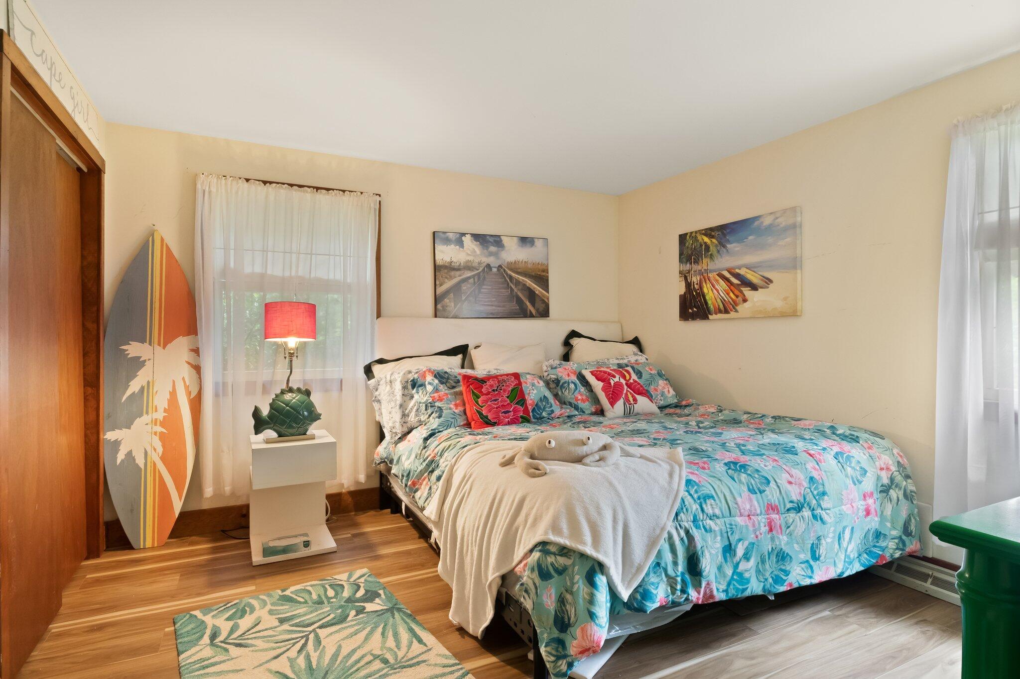 45 Designers Road Wellfleet, MA 02667 - Photo 42 of 84 a bedroom with a bed and a painting on the wall