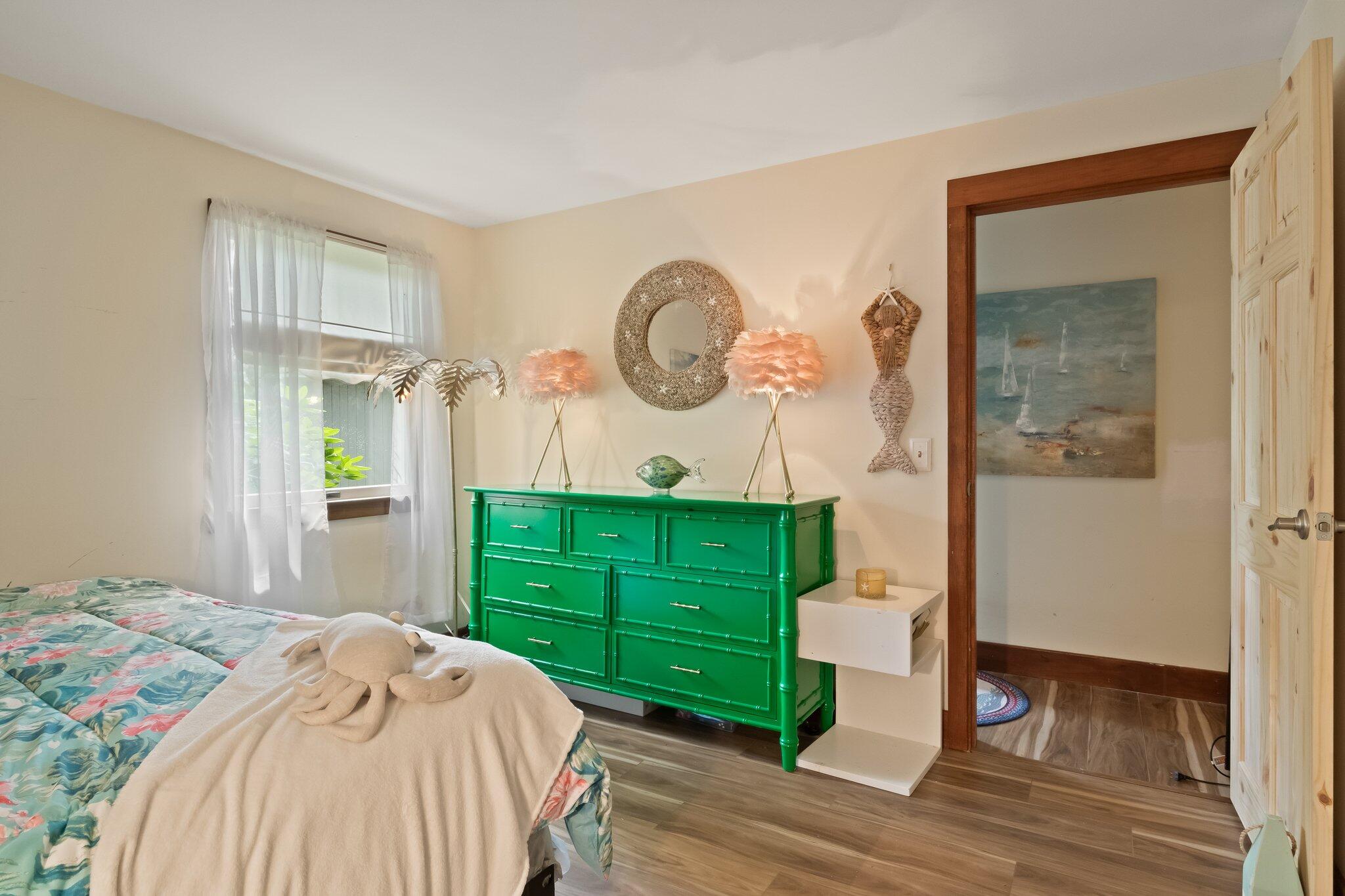 45 Designers Road Wellfleet, MA 02667 - Photo 43 of 84 a bedroom with a bed and a mirror