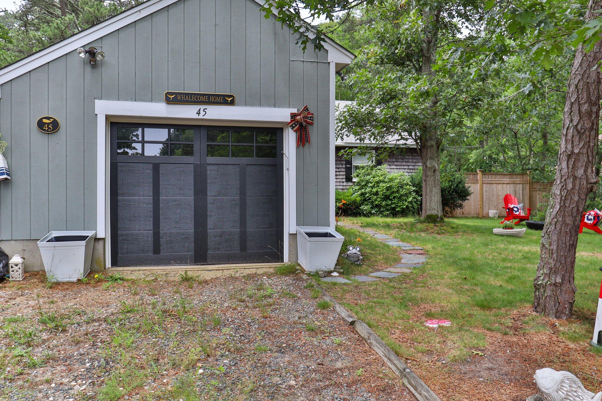45 Designers Road Wellfleet, MA 02667 - Photo 48 of 84 a front view of a house with garden