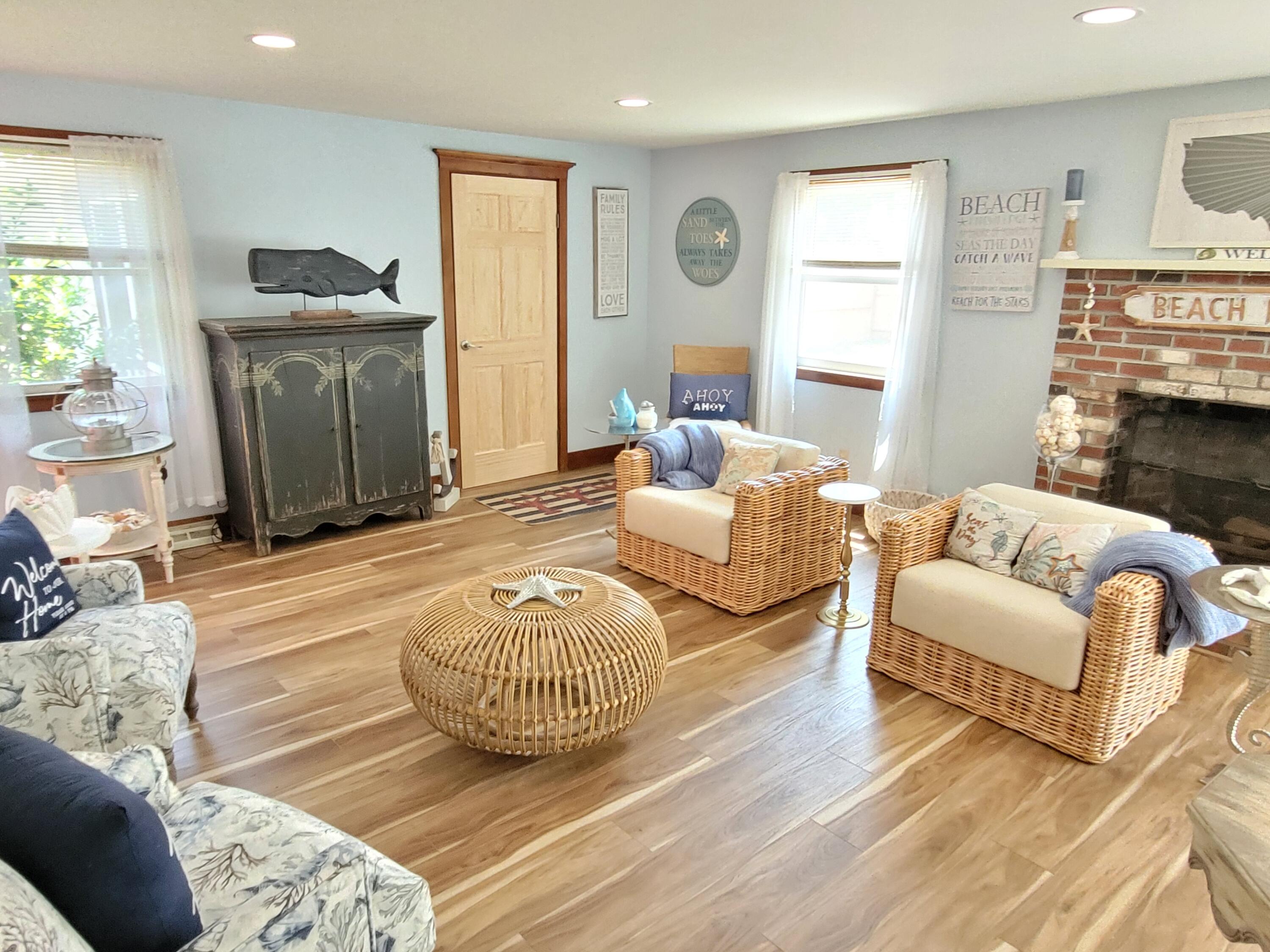 45 Designers Road Wellfleet, MA 02667 - Photo 7 of 84 a living room with furniture and a fireplace
