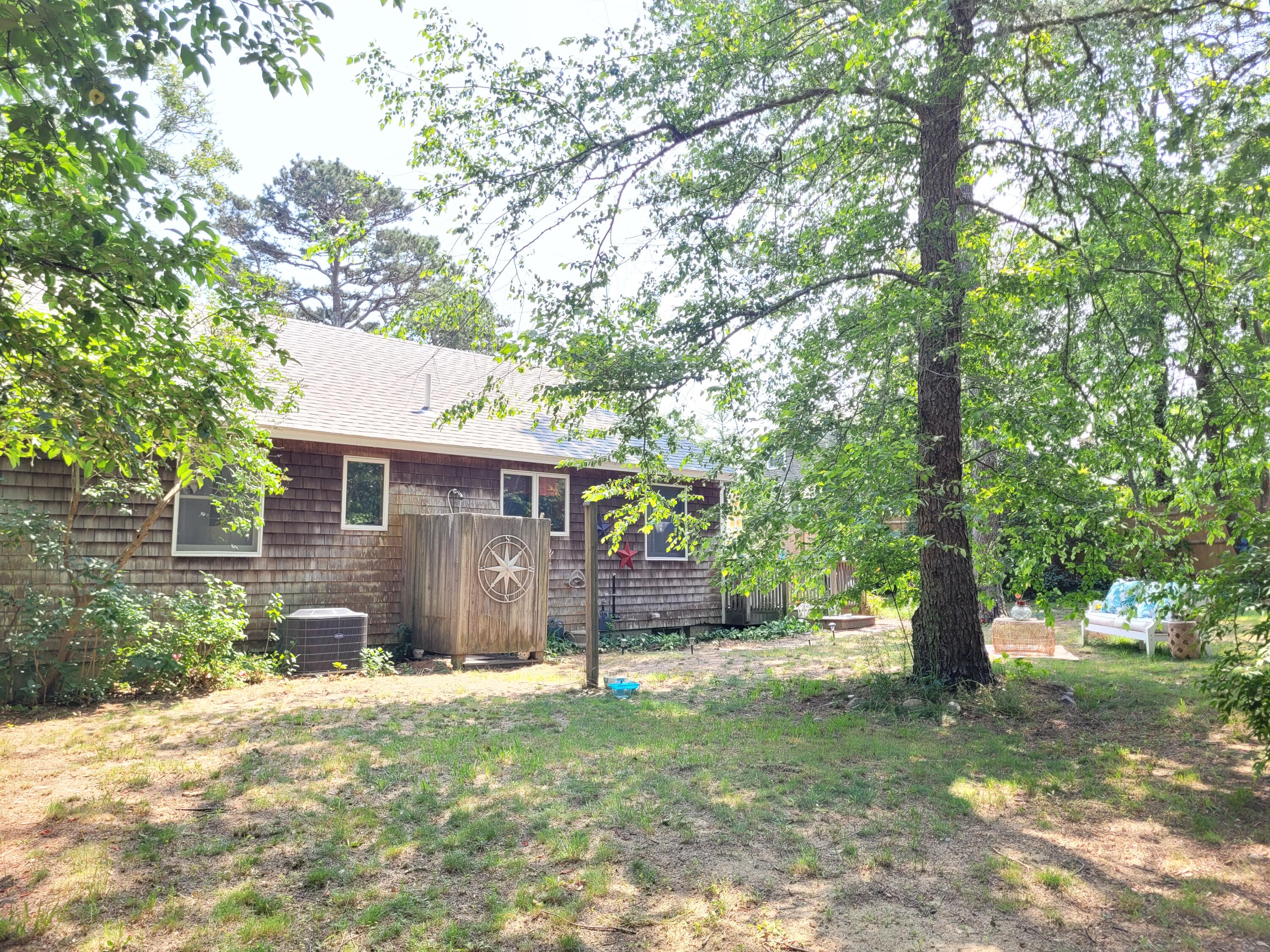 45 Designers Road Wellfleet, MA 02667 - Photo 73 of 84 a front view of a house with a yard