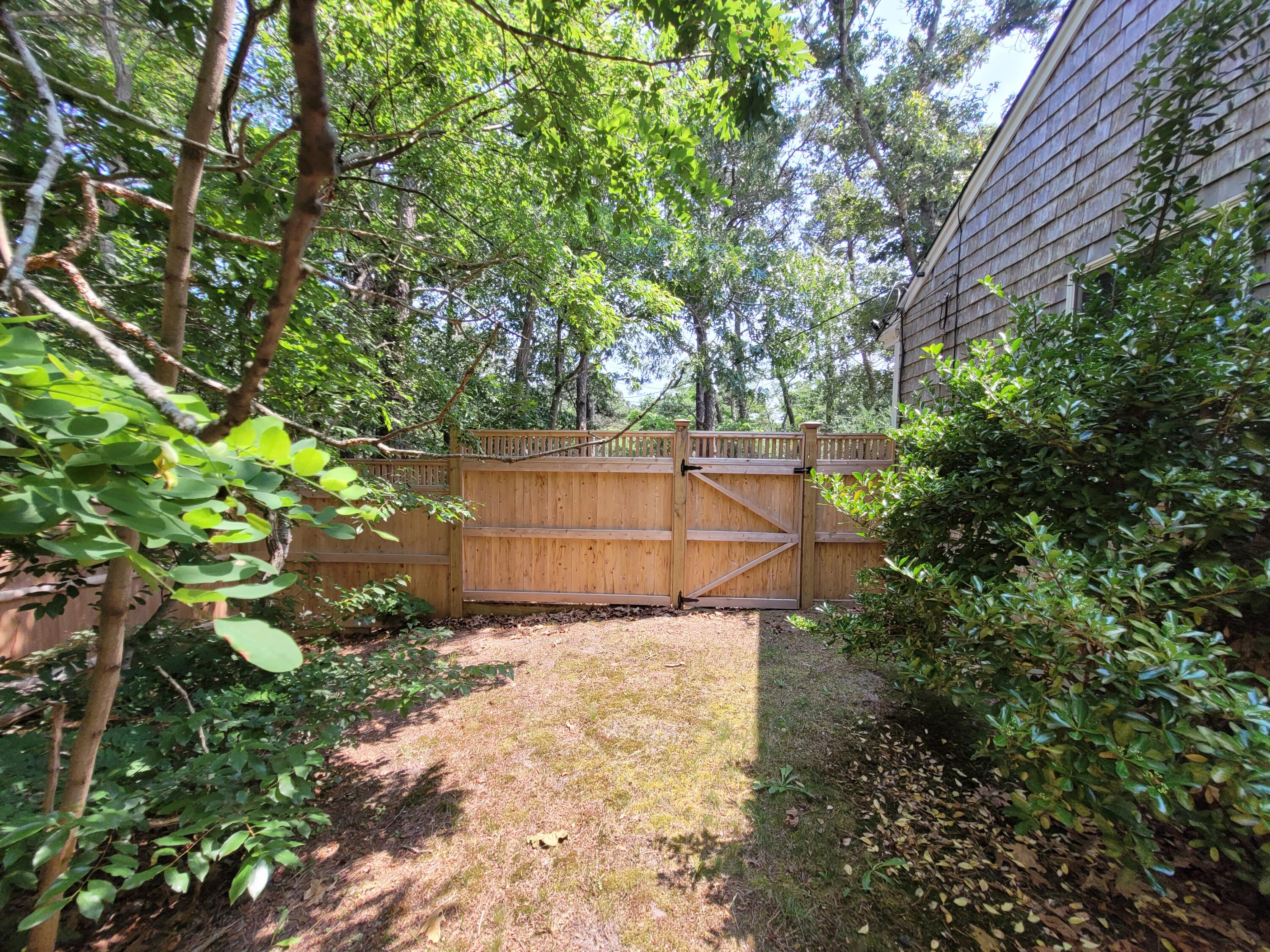 45 Designers Road Wellfleet, MA 02667 - Photo 74 of 84 a backyard of a house