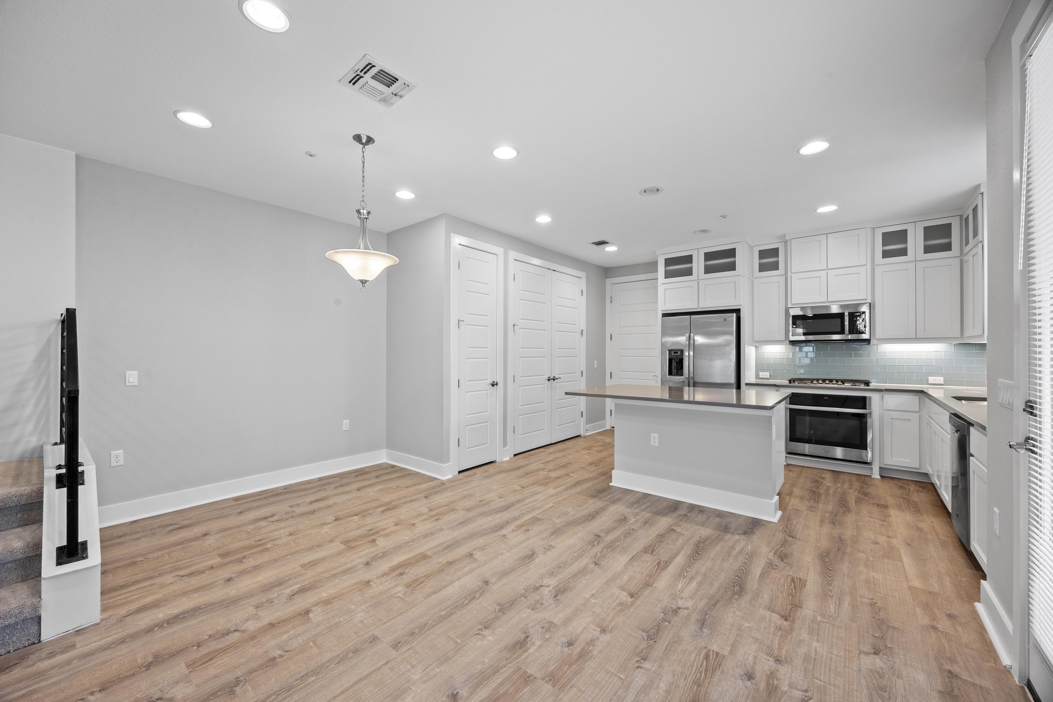 2222 Simond Avenue, Unit E Austin, TX 78723 - Photo 6 of 28 The kitchen is open to the living and dining areas.
