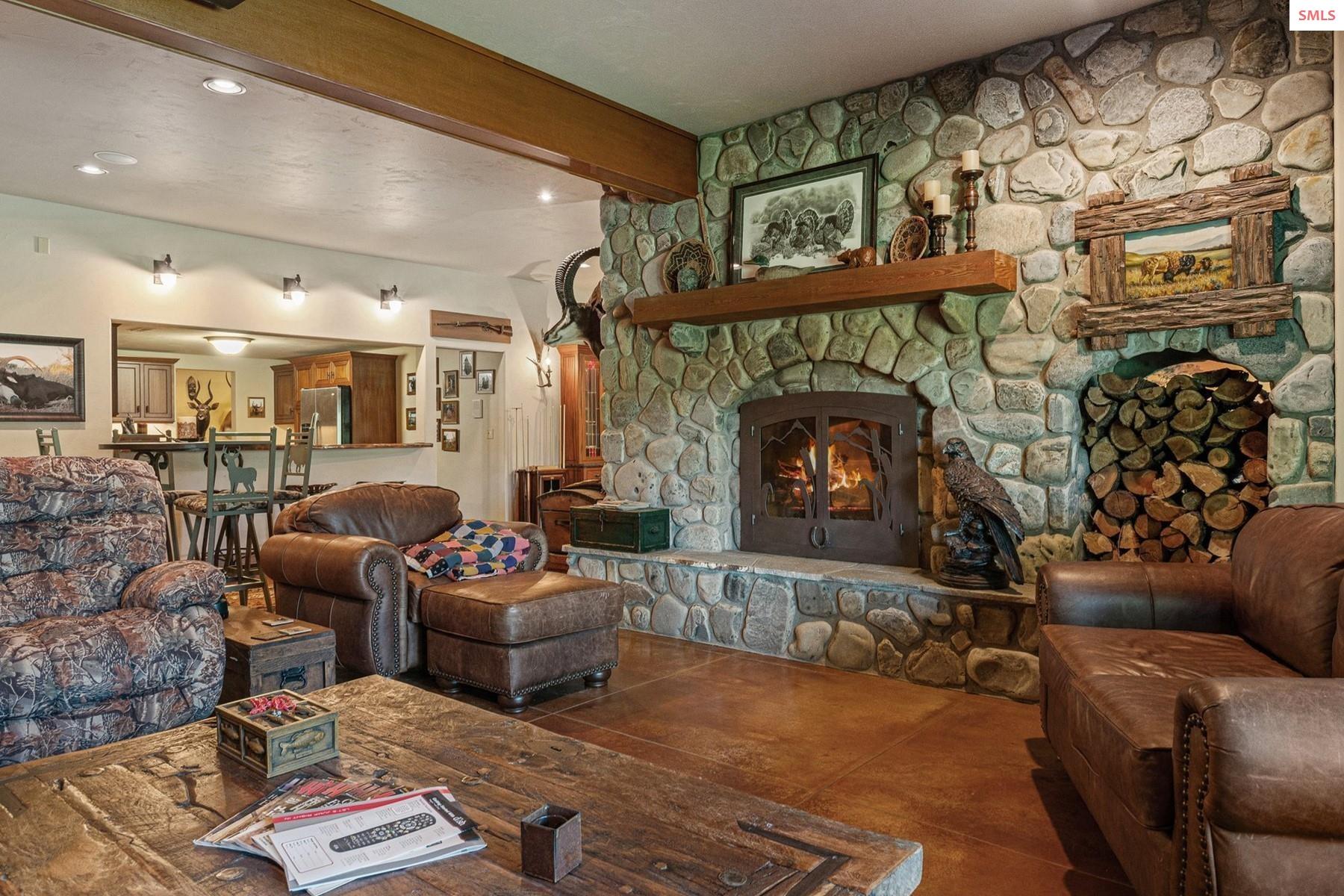 526 Roop Road Cocolalla, ID 83813 - Photo 52 of 100 Downstairs living room, looking back toward kitchen and dining area