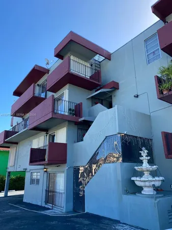 a view of a house with pool and wooden floor