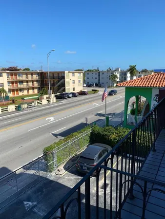 a view of a patio with a table and chairs