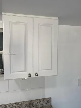 a view of a wooden door and entryway