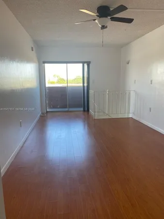 a view of a kitchen and a window