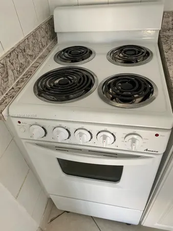 a close view of a stove a microwave and stove