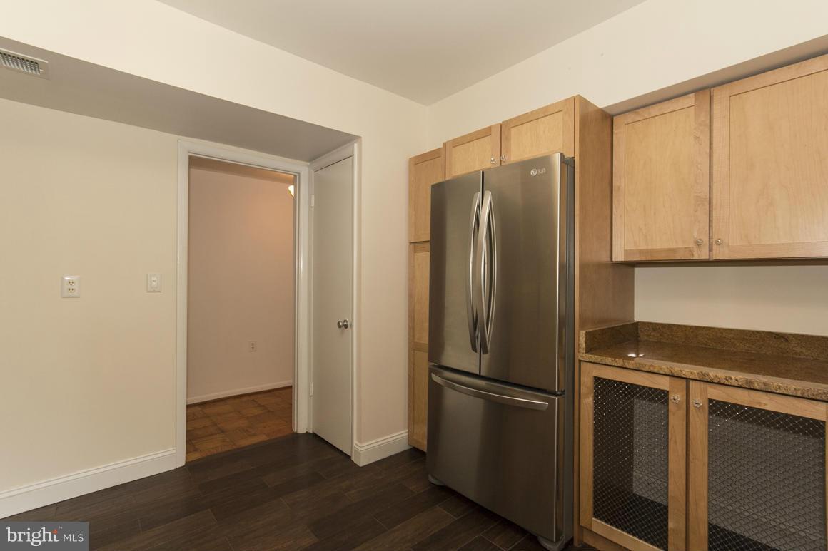 121 Cross Keys Road, Unit A Baltimore, MD 21210 - Photo 5 of 24 a metallic refrigerator freezer sitting in a kitchen