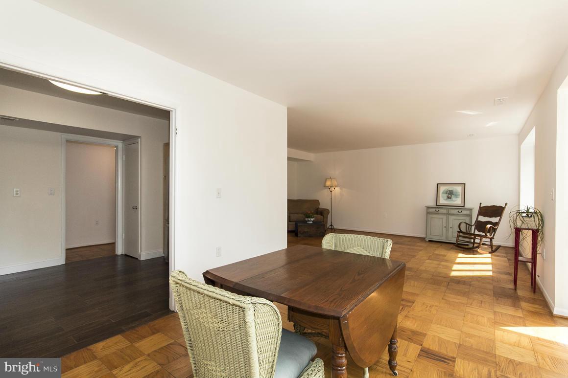 121 Cross Keys Road, Unit A Baltimore, MD 21210 - Photo 7 of 24 a living room with furniture and a table