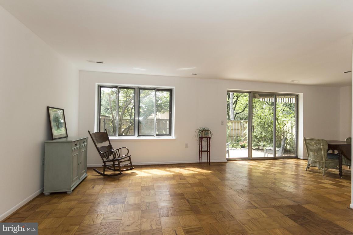 121 Cross Keys Road, Unit A Baltimore, MD 21210 - Photo 10 of 24 a view of a livingroom with a furniture and floor to ceiling window