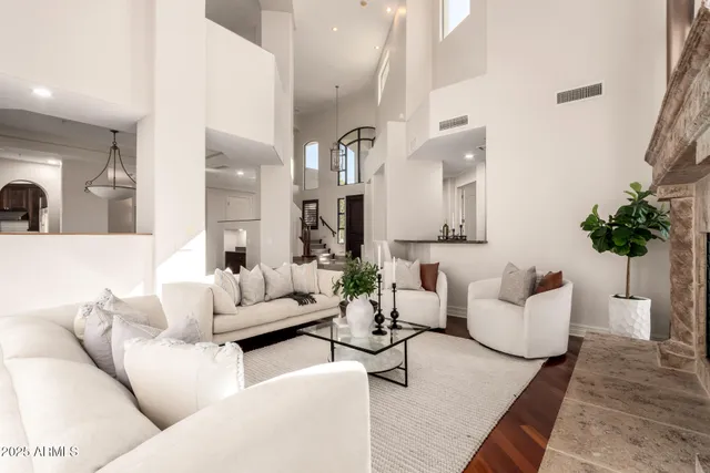 a living room with fireplace furniture and a flat screen tv