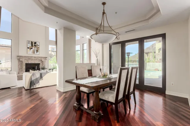 a kitchen with kitchen island a counter top space cabinets and stainless steel appliances
