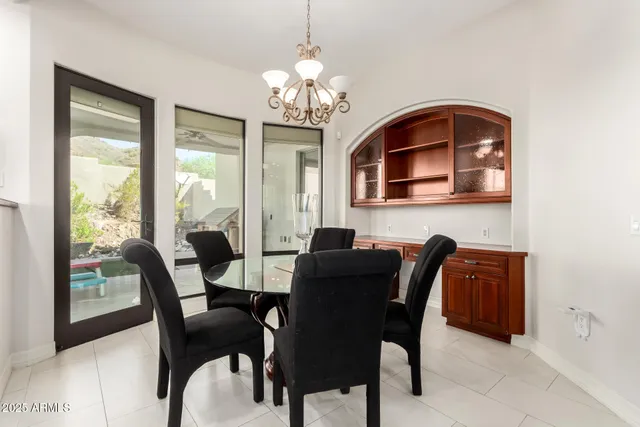 a kitchen with granite countertop stainless steel appliances a sink stove and cabinets