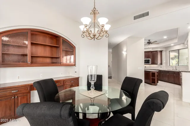 a kitchen with granite countertop stainless steel appliances a sink and cabinets