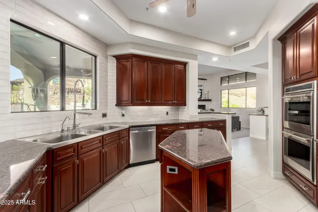 a bedroom with furniture and a flat screen tv